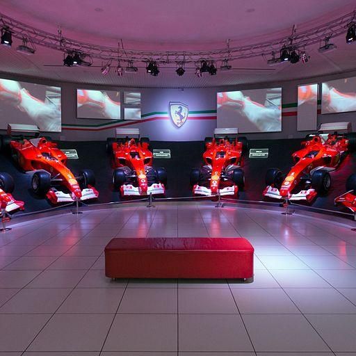 Ferrari Formula 1 cars on display in a museum hall